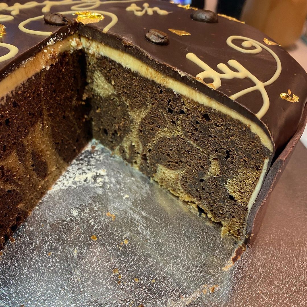 marbled mud cake with chocolate, caramilk and coffee flavours with a vanilla buttercream and chocolate ganache