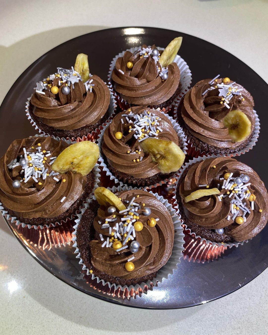 Chocolate cupcake, banana creme Patissiere and chocolate ganache with a dried banana chip