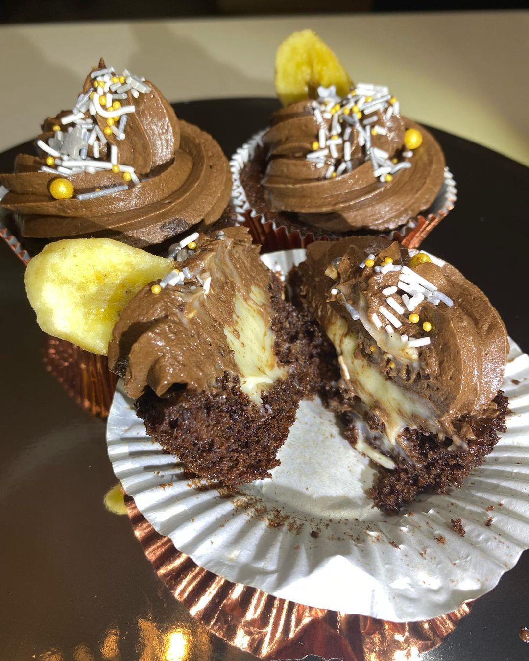 Chocolate cupcake, banana creme Patissiere and chocolate ganache with a dried banana chip
